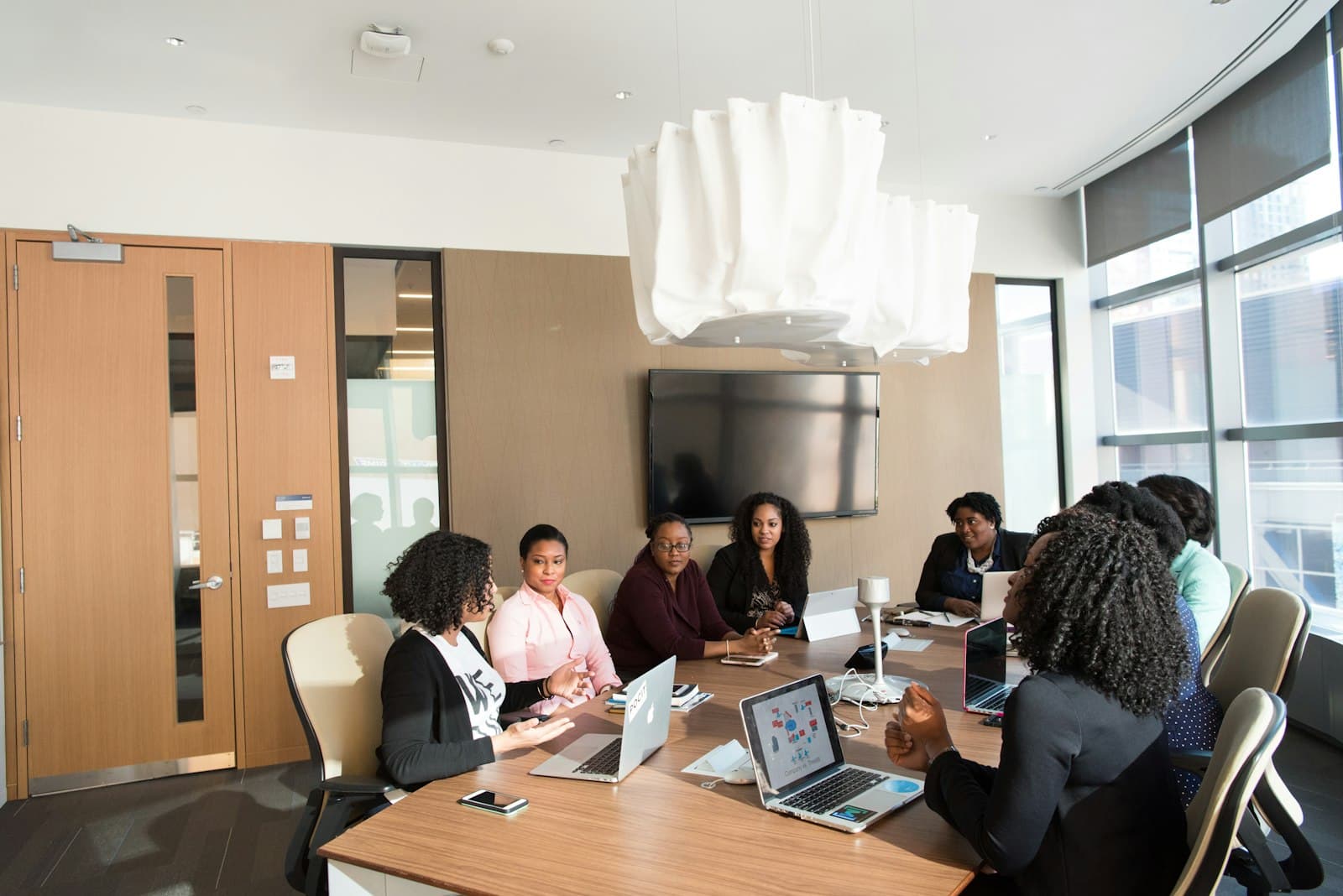 A diverse team collaborating in an inclusive, accessible open-plan workplace.